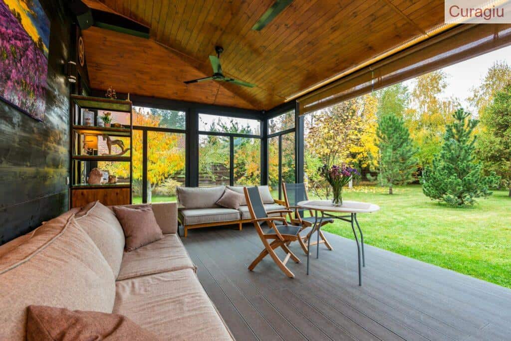 Elegant modern porch with comfortable seating and vibrant garden view.